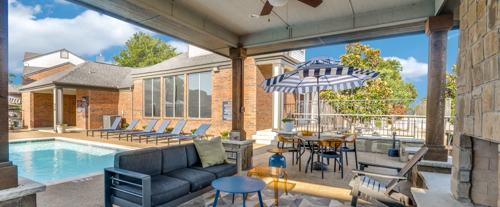 the patio has a pool and a grill at The  Hathaway at Willow Bend