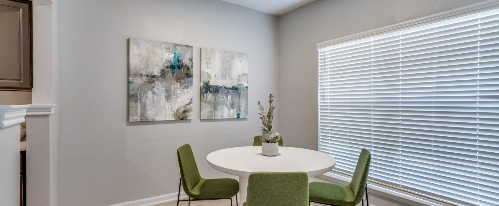 a dining room with a table and chairs at The  Hathaway at Willow Bend