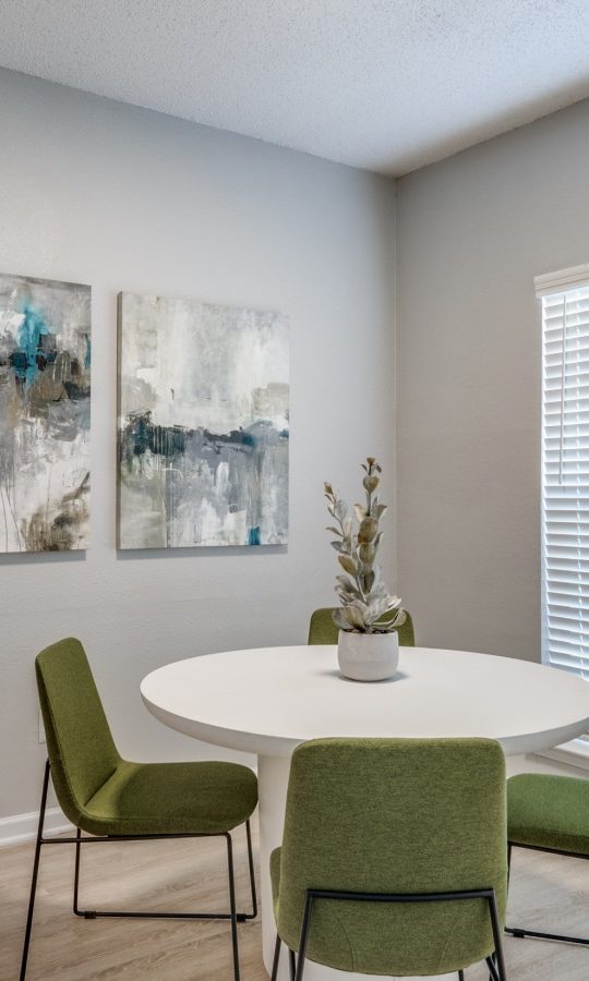 a dining room with a table and chairs at The  Hathaway at Willow Bend