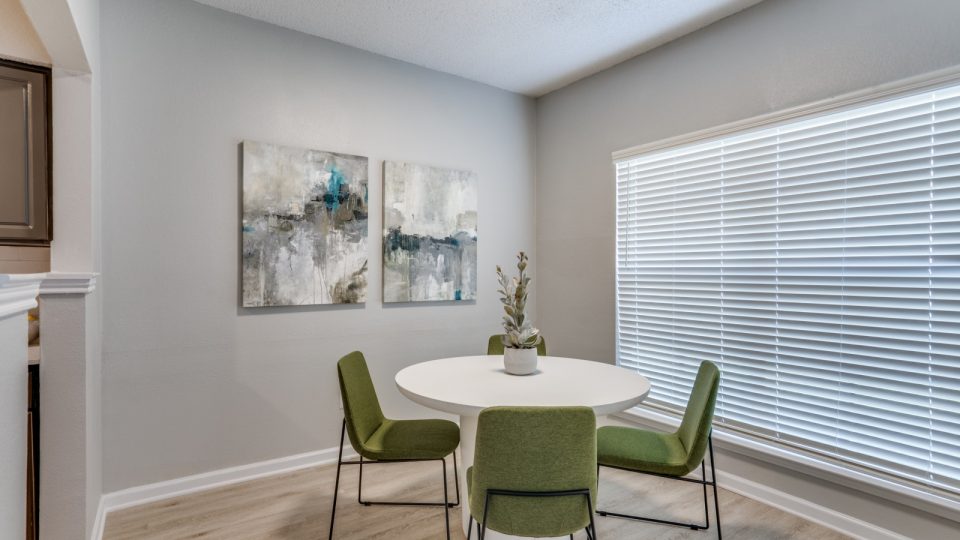 a dining room with a table and chairs at The Hathaway at Willow Bend