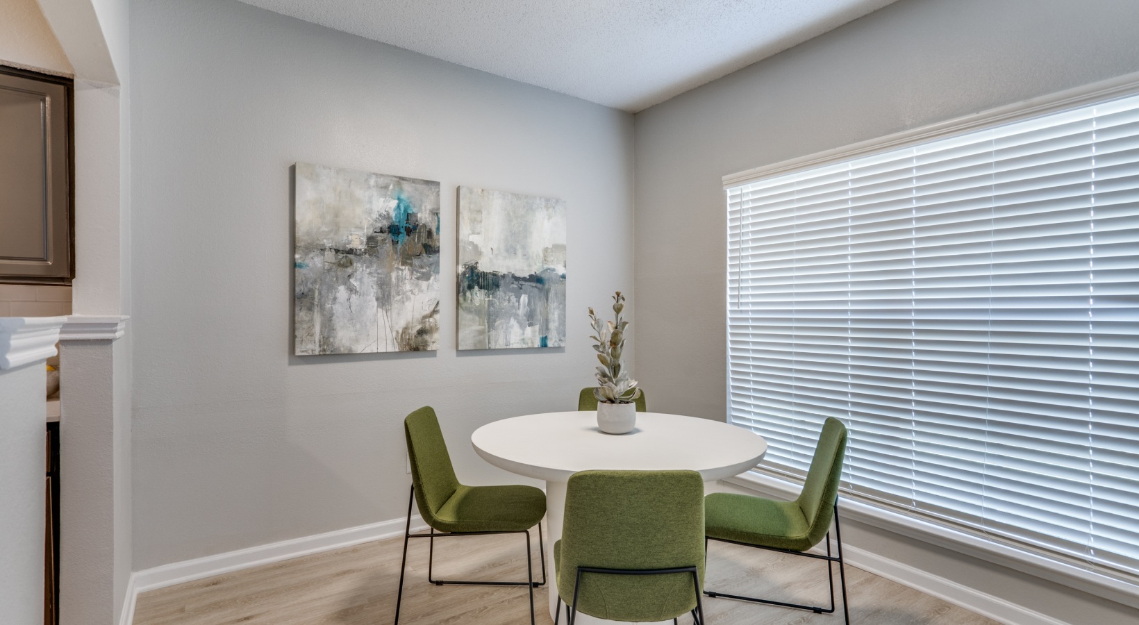 a dining room with a table and chairs at The Hathaway at Willow Bend