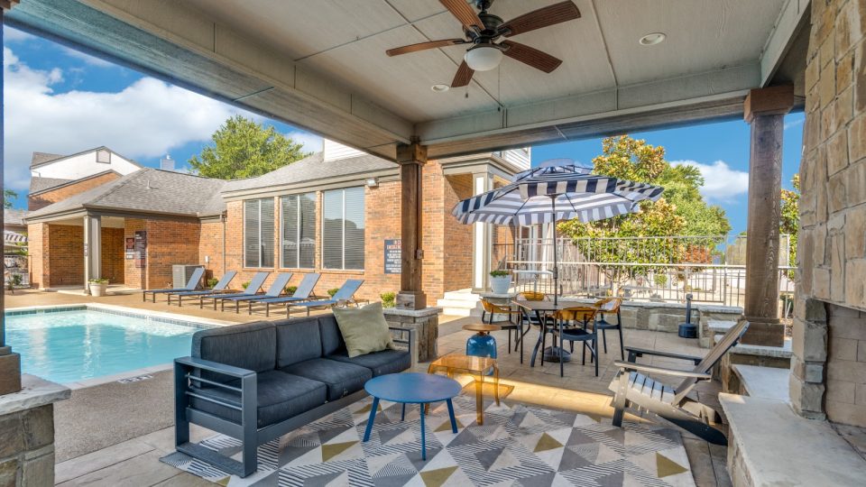 the patio has a pool and a grill at The  Hathaway at Willow Bend